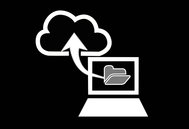 Illustration of a laptop backing up a folder to the cloud